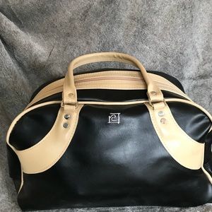 Black and tan bowling-style bag.